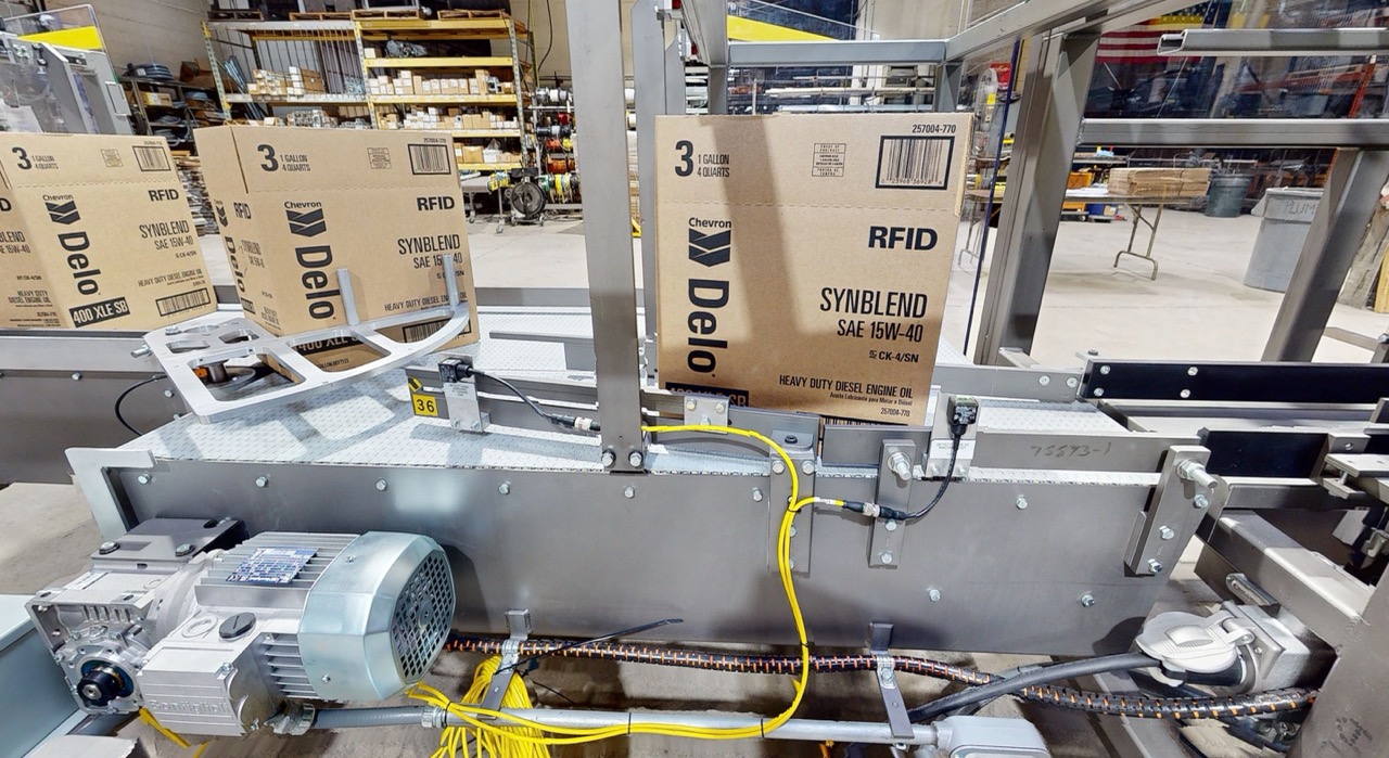 Wayne Automation Case Turner handling boxes on a production line